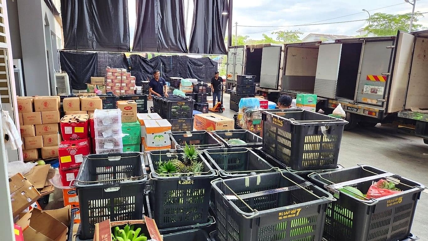 Boxes and crates of fresh produce staged for delivery at Prospect Trading's warehouse